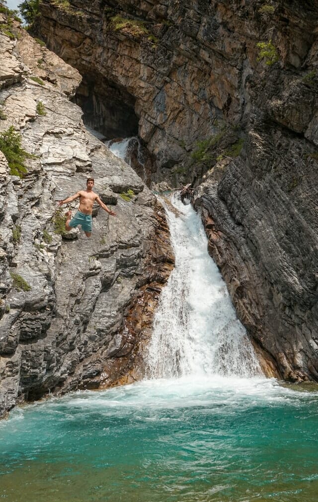 a man cliff jumping